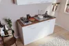 A small, compact kitchen setup with a sink, stovetop, and cabinets, styled in a modern, minimalist aesthetic. Produktbild-Vorschau