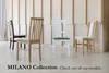 Four dining chairs are displayed in a room with a light wood paneled wall. Voir les images du produit