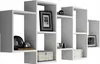 A white modular wall shelf unit with decorative items. Produktbild-Vorschau