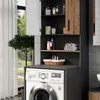 A laundry room with a washing machine and a cabinet for storage. Voir les images du produit