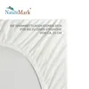 A close-up of a white fitted sheet with text overlay. Produktbild-Vorschau