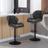 Two black bar stools are shown in a modern kitchen or bar area. Produktbild-Vorschau