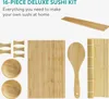 A flat lay of a 16-piece deluxe sushi kit made of bamboo, laid out on a white background. Produktbild-Vorschau