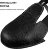 Close-up of a black safety shoe cover made of leather. Produktbild-Vorschau