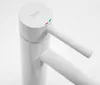 A close-up studio shot of a white faucet. Náhled obrázku produktu