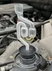 A close-up of a CO2 leak tester for a car's cylinder head gasket, placed on top of the car's radiator cap. Anteprima dell’immagine prodotto