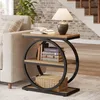 A side table with books and a lamp next to a sofa in a living room. Anteprima dell’immagine prodotto
