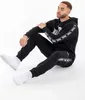 Pánske bežecké nohavice regular fit GRUTNESS Black/White Náhľad obrázku produktu 4