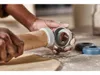 Hands are using a rolling pin with adjustable guides to roll out dough on a floured surface. Several other guides are visible in the background. Produktbild-Vorschau