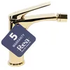 A gold-colored bidet faucet with a warranty tag attached. Produktbild-Vorschau
