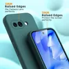 A close-up marketing image showing a green phone case on a light blue and white background, highlighting its raised edges for camera and screen protection. Produktbild-Vorschau