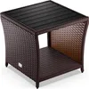 A brown polyrattan side table with a black WPC tabletop is shown against a white background. Anteprima dell’immagine prodotto