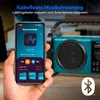 A hand holding a smartphone displaying a radio app, with a blue portable radio in the background. Produktbild-Vorschau