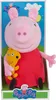 A plush toy of Peppa Pig holding a yellow toy, presented in its packaging. Produktbild-Vorschau