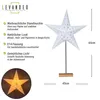 A white star-shaped paper lamp with a wooden base, shown with descriptive text and dimensions. Produktbild-Vorschau
