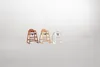 Three high chairs are displayed in a studio setting with a plain background. Podgląd zdjęcia produktu