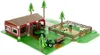 A toy farm set with a barn, tractor, trailer, fence, and farm animals. Produktbild-Vorschau