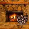 A fireplace with a fire burning and a U-shaped log holder filled with firewood next to it. Produktbild-Vorschau