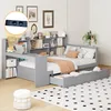 A grey bed with storage drawers and a built-in desk and bookshelf, set up in a bedroom. Produktbild-Vorschau