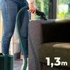 A person is using a carpet cleaner on a sofa. Produktbild-Vorschau