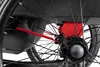 A close-up view of the wheel and frame of a child's bicycle trailer. Produktbild-Vorschau