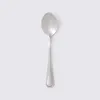 A single silver spoon is centered on a light gray background. Náhled obrázku produktu