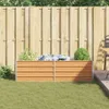 A raised garden bed with plants in a backyard setting. Voir les images du produit