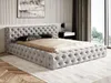 A tufted upholstered bed in a bedroom setting. Náhľad obrázku produktu