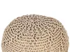 A close-up view of a beige knitted pouf. Náhled obrázku produktu