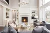 A luxurious living room with a fireplace and seating area. Náhľad obrázku produktu