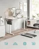 A modern home office setup with a height-adjustable desk, computer, lamp, and storage. Produktbild-Vorschau