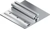 A close-up isometric view of metal components, including an aluminum extrusion profile and a curved metal plate with screw holes, resting on a larger metal sheet. Voir les images du produit