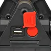 A close-up view of the ports and buttons on a black electronic device, with a red protective cover and a red power button. Voir les images du produit