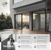 A modern building with a retractable awning extended over a wooden deck. Produktbild-Vorschau