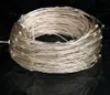 A coiled string of LED lights on a black background. Voir les images du produit