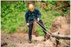 A man rappelling down a rocky cliff face. Produktbild-Vorschau
