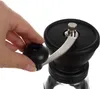 A hand is shown operating a manual coffee grinder. Náhľad obrázku produktu