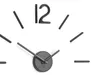 A close-up of a modern wall clock with a minimalist design, showing the clock face, hands, and some of the hour markers. Produktbild-Vorschau