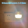 A night light plugged into a wall socket, illuminating the area. Produktbild-Vorschau