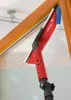 A Vileda window cleaner with a telescopic handle is being used to clean a window frame. Produktbild-Vorschau