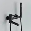 A black wall-mounted bathtub faucet with a handheld showerhead. Produktbild-Vorschau