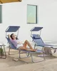 A woman relaxing on a blue chaise lounge outdoors, with another chaise lounge in the background. Produktbild-Vorschau