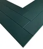 A close-up view of dark green wooden planks arranged in a herringbone pattern. Podgląd zdjęcia produktu