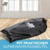 A black storage bag with a logo on a wooden surface in front of a blurred background with windows and a brick wall. Produktbild-Vorschau