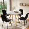 A dining set with a round marble-top table and four black velvet chairs in a well-lit room. Anteprima dell’immagine prodotto