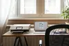 A home office setup with a printer and laptop on a desk. Podgląd zdjęcia produktu