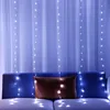 A string of white LED lights hangs in front of sheer white curtains, with a blue couch and a brown pillow visible below. Produktbild-Vorschau
