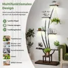 A multi-tiered plant stand with integrated lights, showcasing various items like plants, books, and decorative objects. Podgląd zdjęcia produktu