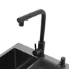 A black kitchen sink faucet and sink are shown against a white background. Náhled obrázku produktu