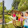 Children playing with water guns in a backyard with a solar shower. Náhľad obrázku produktu